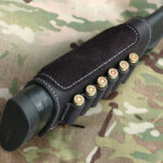 Buttstock cartridge cuff with suede cheek pad